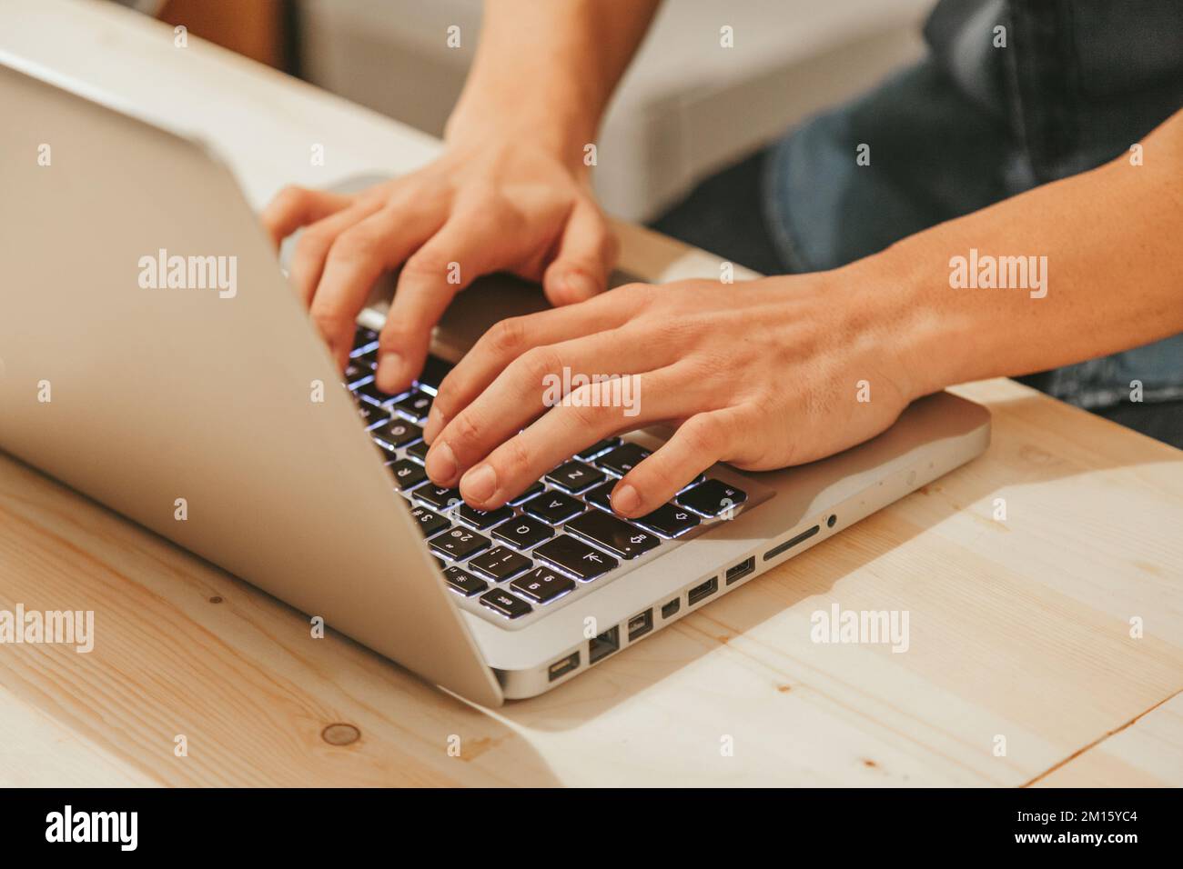 Anonymous man typing on a Modern Laptop Stock Photo