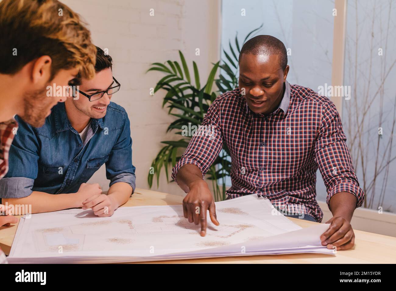 Architects and engineers working at the Creative Office Stock Photo