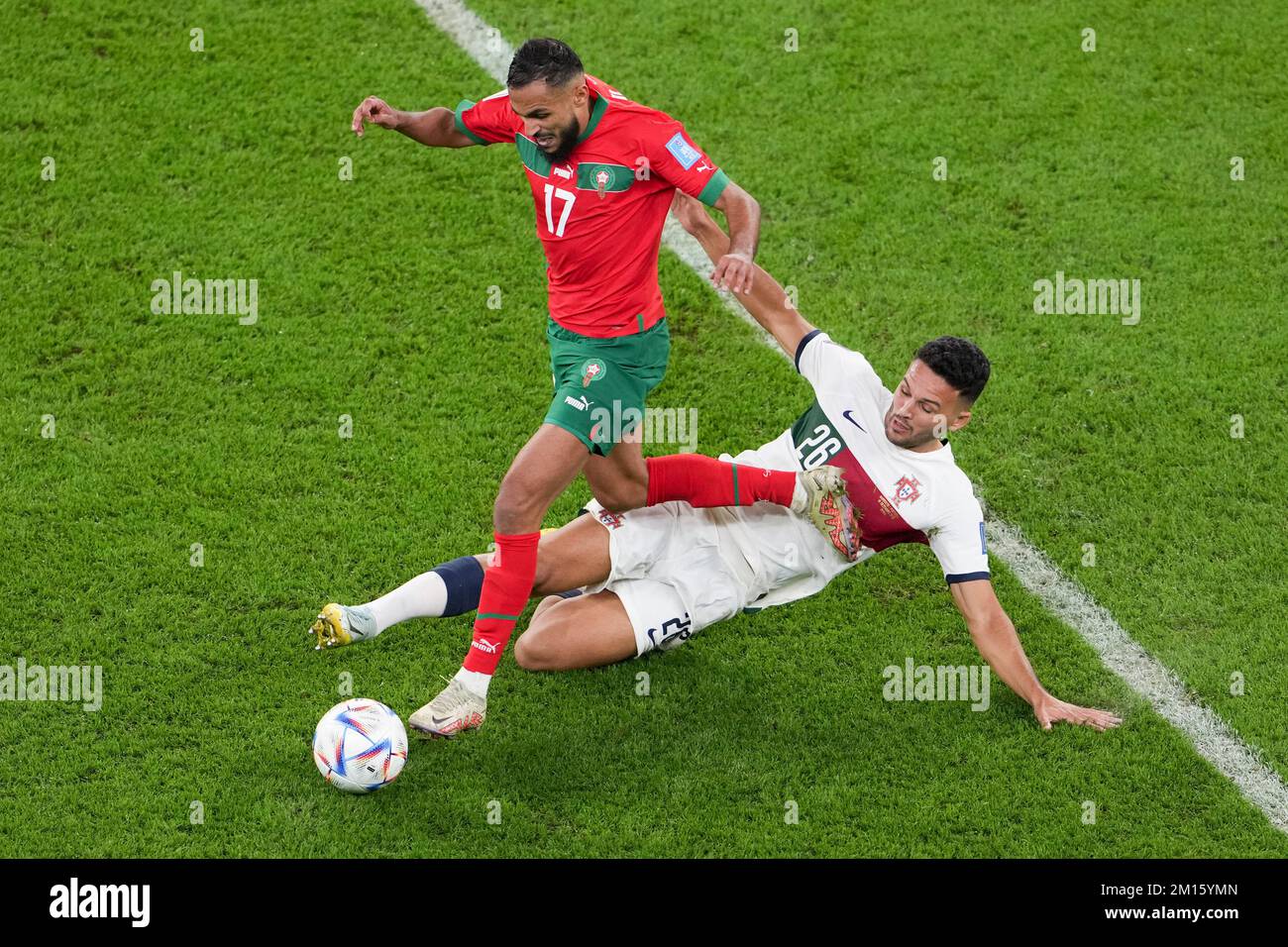 Doha, Qatar. 10th Dec, 2022. Sofiane Boufal (L) of Morocco vies with Goncalo Ramos of Portugal during their Quarterfinal of the 2022 FIFA World Cup at Al Thumama Stadium in Doha, Qatar, Dec. 10, 2022. Credit: Zheng Huansong/Xinhua/Alamy Live News Stock Photo