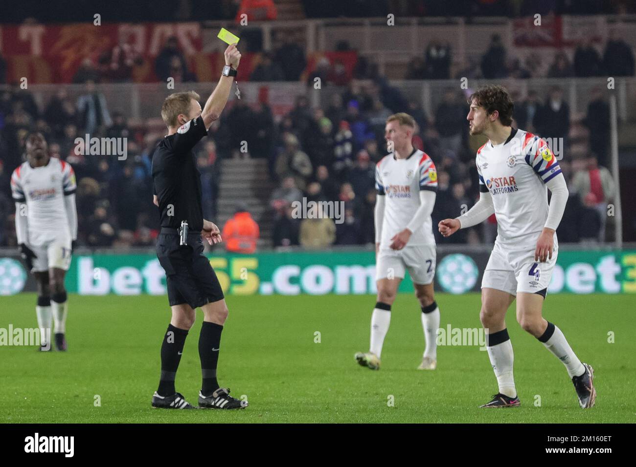 Middlesbrough, UK. 10th Dec, 2022. Referee Gavin Ward awards a yellow card to Tom Lockyer #4 of Luton Town during the Sky Bet Championship match Middlesbrough vs Luton Town at Riverside Stadium, Middlesbrough, United Kingdom, 10th December 2022 (Photo by James Heaton/News Images) in Middlesbrough, United Kingdom on 12/10/2022. (Photo by James Heaton/News Images/Sipa USA) Credit: Sipa USA/Alamy Live News Stock Photo