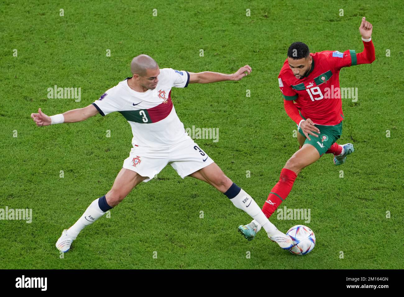 Doha, Qatar. 10th Dec, 2022. Pepe (L) of Portugal vies with Youssef En-Nesyri of Morocco during their Quarterfinal of the 2022 FIFA World Cup at Al Thumama Stadium in Doha, Qatar, Dec. 10, 2022. Credit: Zheng Huansong/Xinhua/Alamy Live News Stock Photo