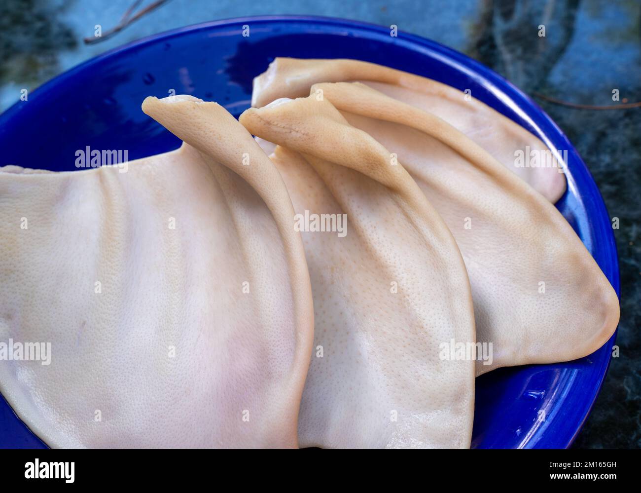 Cooked pork ears. Vietnamese cuisine traditionally includes pork parts such as intestine, pork