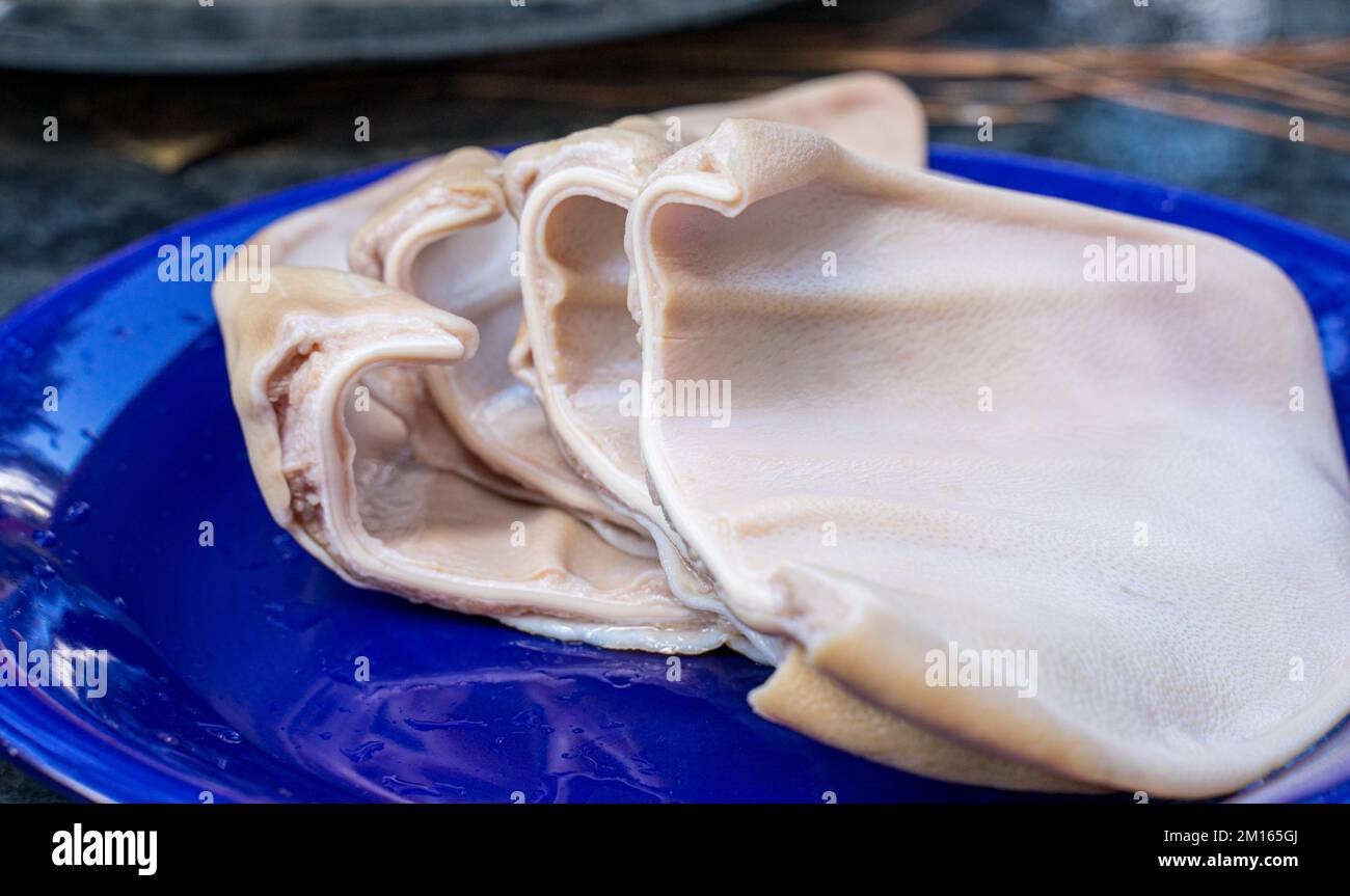 Cooked pork ears. Vietnamese cuisine traditionally includes pork parts such as intestine, pork