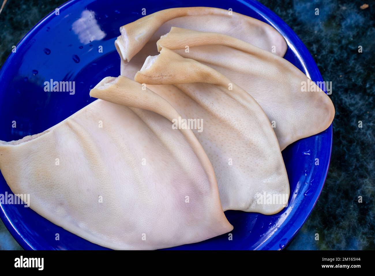 Cooked pork ears. Vietnamese cuisine traditionally includes pork parts such as intestine, pork