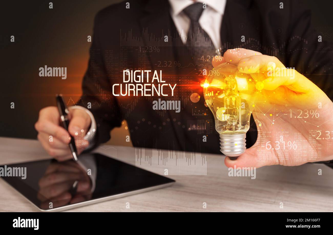 Businessman holding a lightbulb concept Stock Photo - Alamy