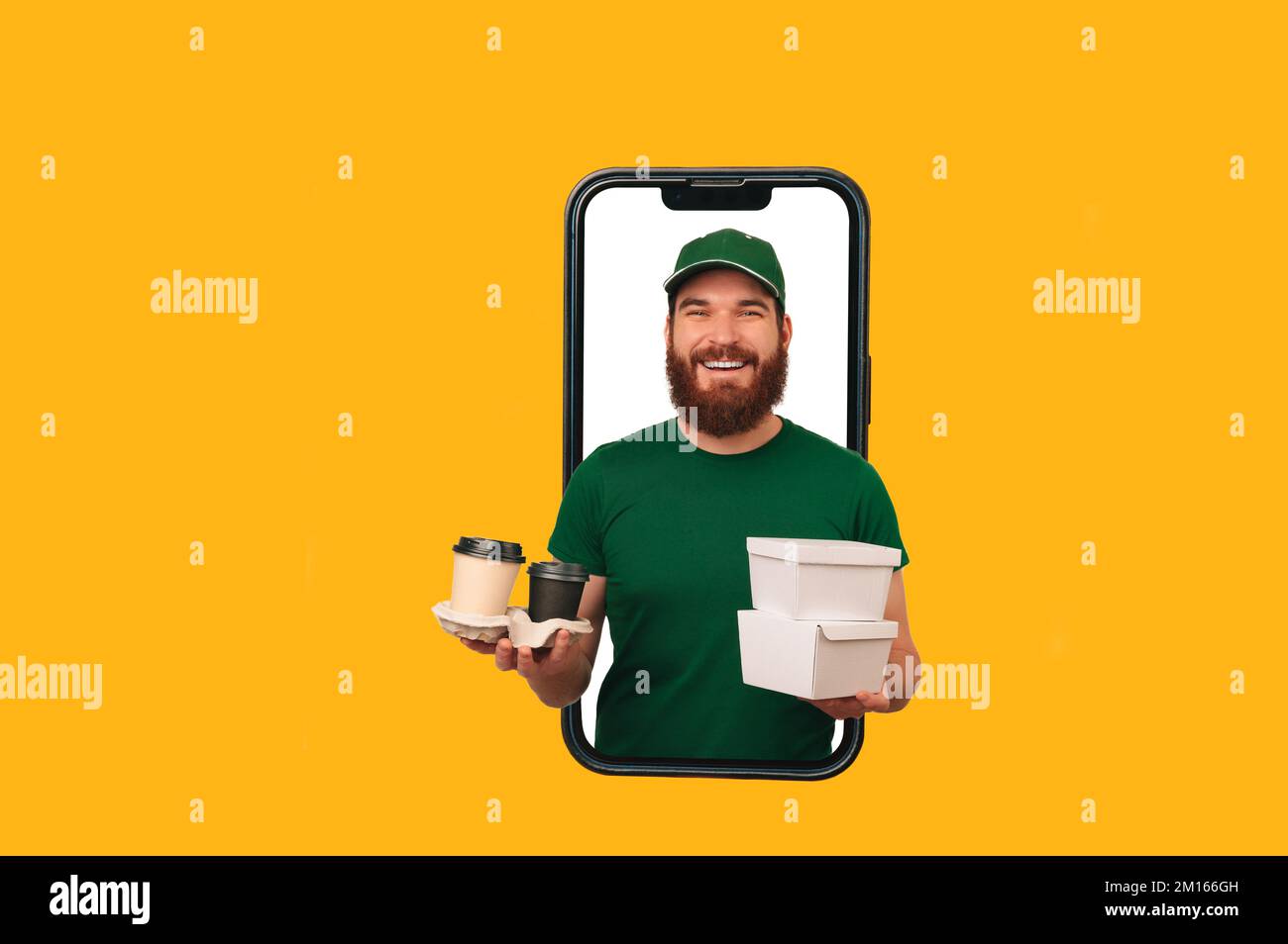 Best mobile app to order food. Delivery man holds lunch boxes and cups
