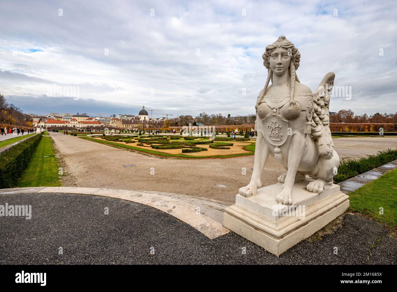 Cityscape with the garden of Schloss Belvedere in Vienna and its statue. Belvedere Castle during the Christmas holidays. Stock Photo