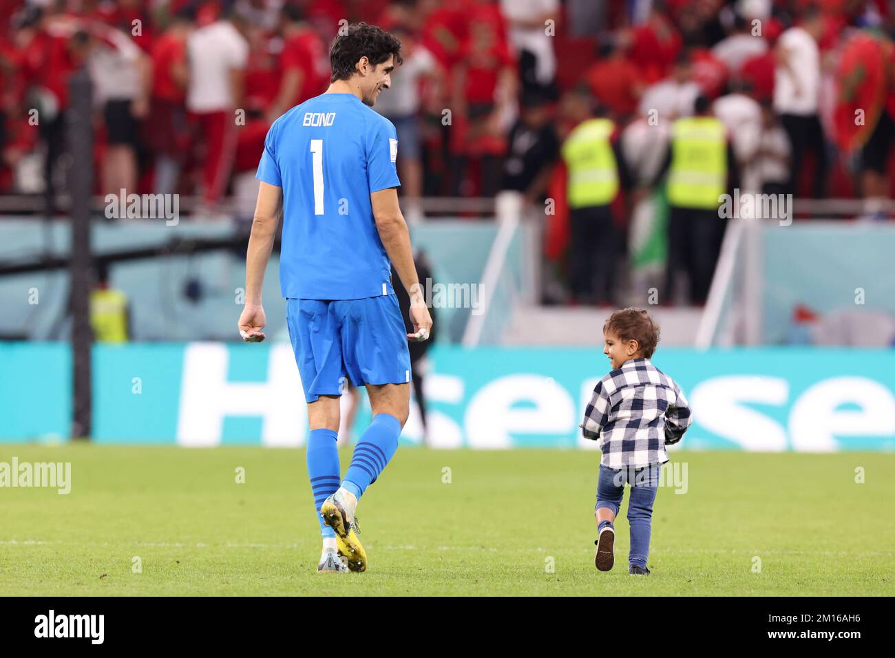 Doha, Qatar. 10th Dec, 2022. Yassine Bounou, goalkeeper of Morocco, celebrates with his son after winning the Quarterfinal between Morocco and Portugal of the 2022 FIFA World Cup at Al Thumama Stadium in Doha, Qatar, Dec. 10, 2022. Credit: Cao Can/Xinhua/Alamy Live News Stock Photo