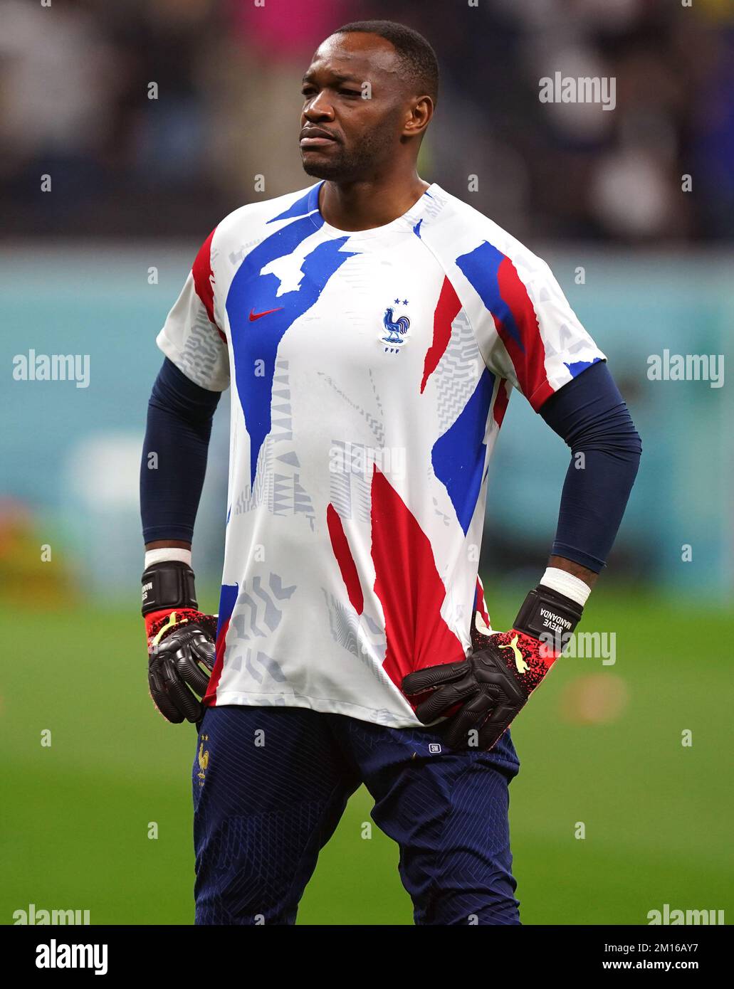 France goalkeeper Steve Mandanda warms up ahead of the FIFA World Cup Quarter-Final match at the Al Bayt Stadium in Al Khor, Qatar. Picture date: Saturday December 10, 2022. Stock Photo
