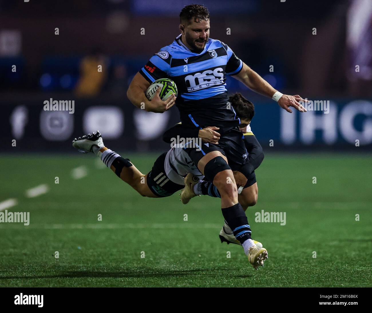 Cardiff Rugby's Thomas Young is tackled by CA Brive's Mathis Ferte in action during the EPCR Challenge Cup match at the Cardiff Arms Park, Cardiff. Picture date: Saturday December 10, 2022. Stock Photo