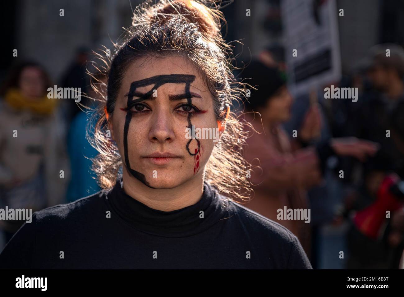 Barcelona, Spain. 10th Dec, 2022. A woman with a gallows drawn on her face seen during the demonstration. Coinciding with Human Rights Day, hundreds of demonstrators have demonstrated in the center of Barcelona to protest against the repression of the Iranian regime and against the death sentences of those detained during the demonstrations. Credit: SOPA Images Limited/Alamy Live News Stock Photo