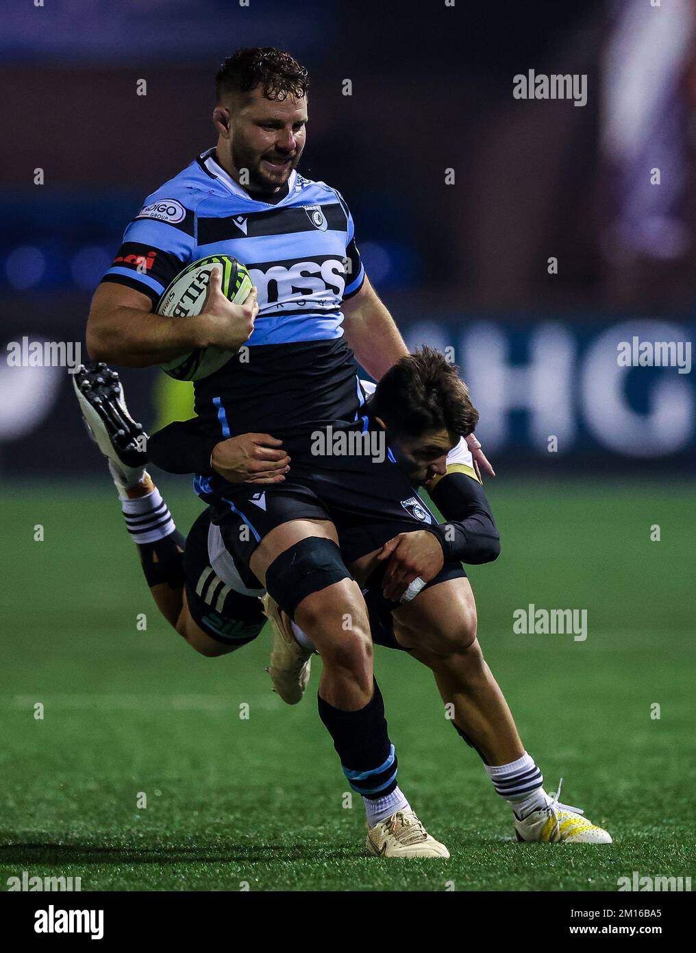 Cardiff Rugby's Thomas Young is tackled by CA Brive's Mathis Ferte in action during the EPCR Challenge Cup match at the Cardiff Arms Park, Cardiff. Picture date: Saturday December 10, 2022. Stock Photo