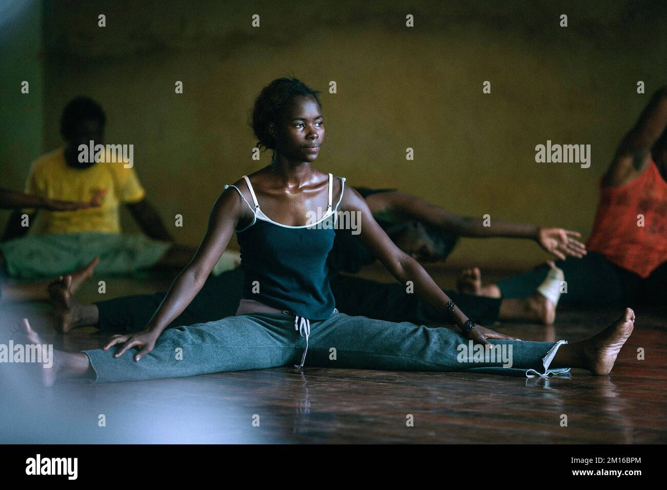 Female contemporary dancer and dancers doing workout at dance school in Bamako , Mali, West Africa Stock Photo