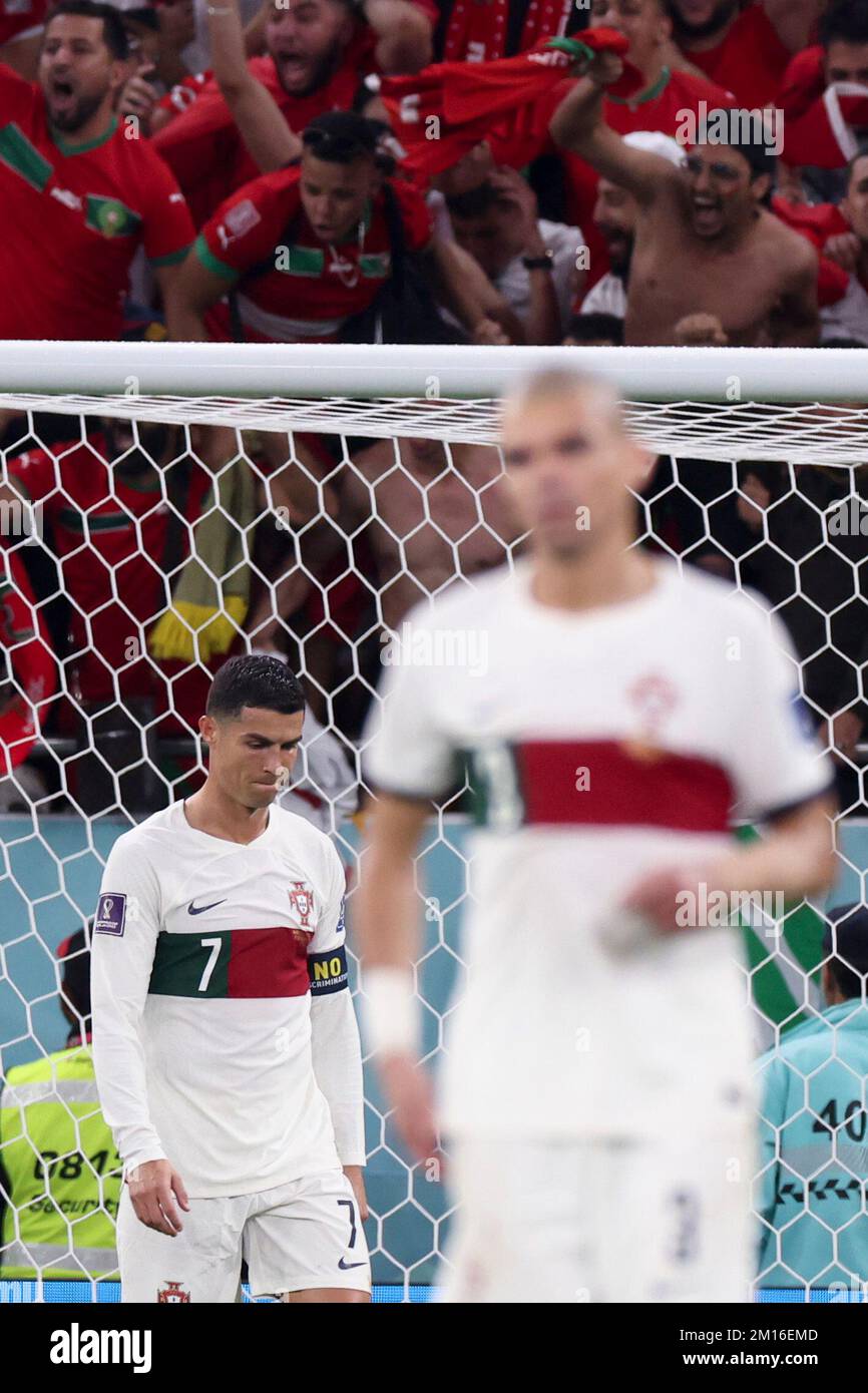 Doha, Qatar. 10th Dec, 2022. Cristiano Ronaldo (L) and Pepe of Portugal react after they lost the Quarterfinal between Morocco and Portugal of the 2022 FIFA World Cup at Al Thumama Stadium in Doha, Qatar, Dec. 10, 2022. Credit: Cao Can/Xinhua/Alamy Live News Stock Photo