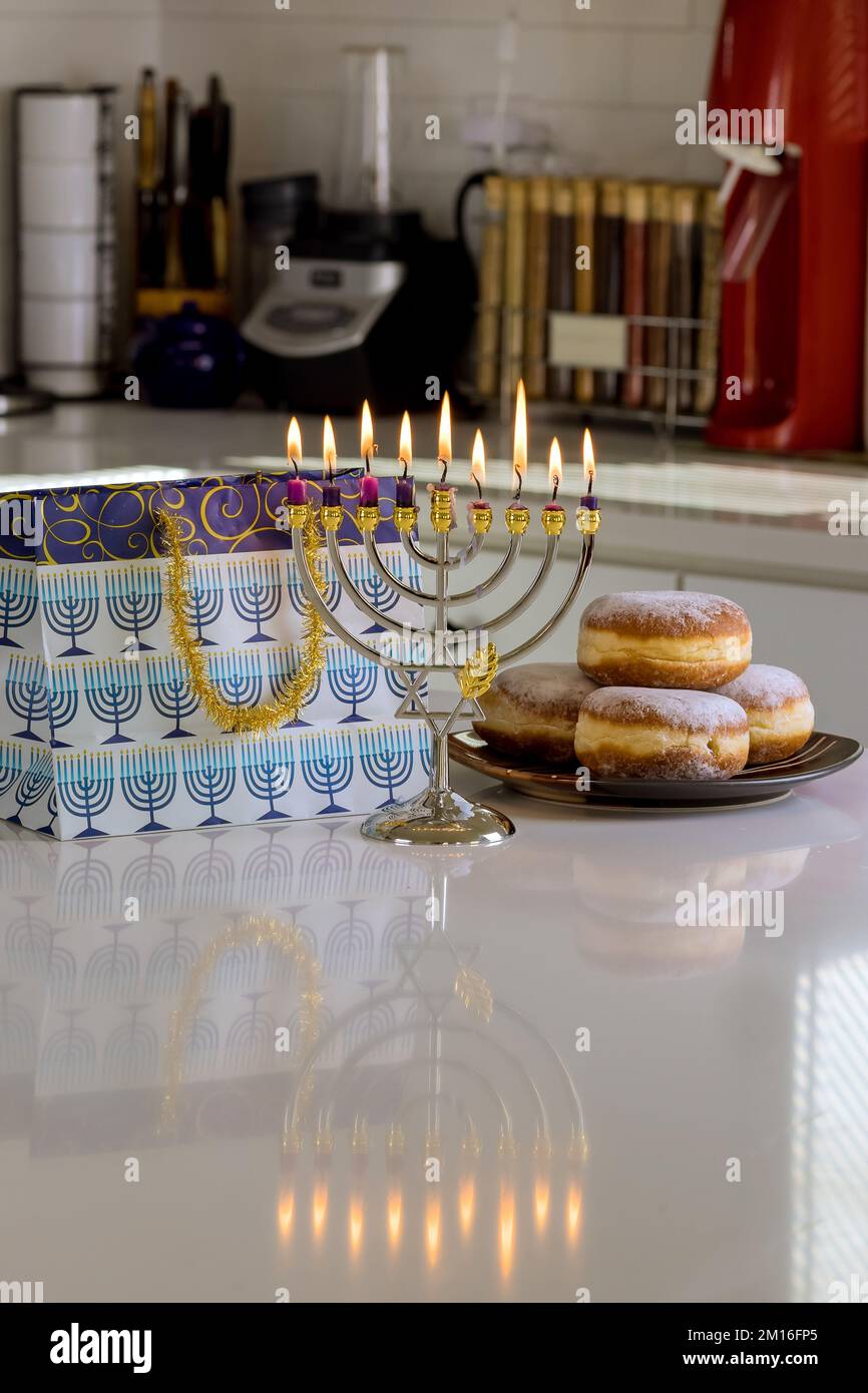Jewish culture holiday symbol, candles are lit on Hanukkiah Menorah to