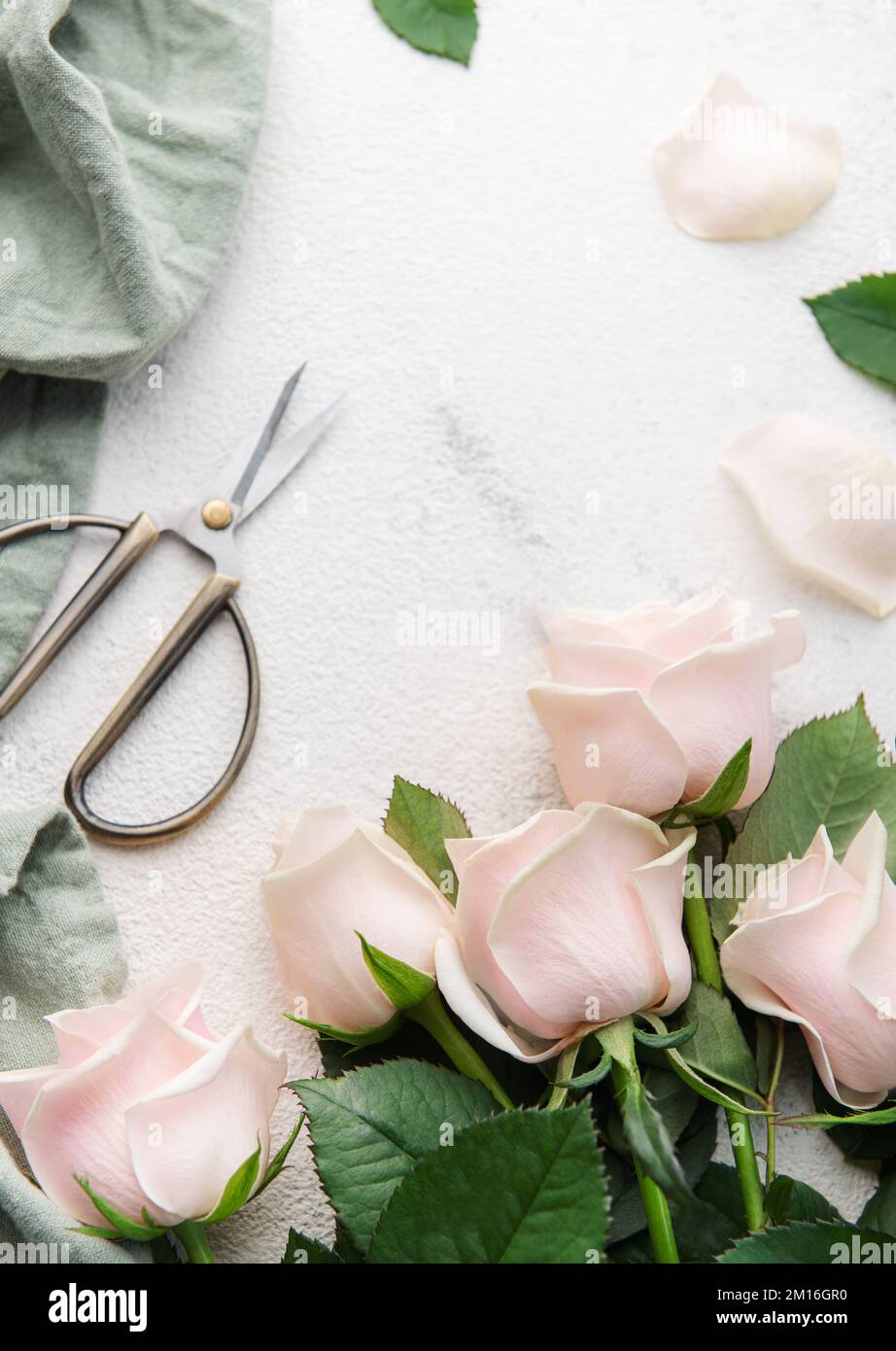 Close up view - floral cutter and colorful flowers bouquet - roses on table  at studio, flower shop. Floristry, romantic, birthday, handmade and small  Stock Photo - Alamy