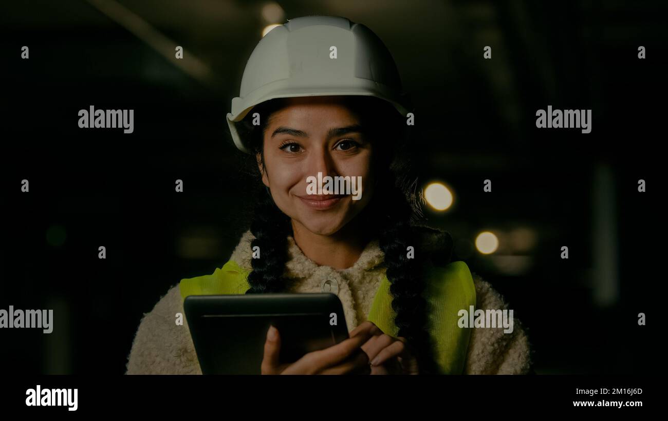Professional engineer architect technical supervisor boss builder wearing hardhat stand on underground construction site female inspector woman Stock Photo