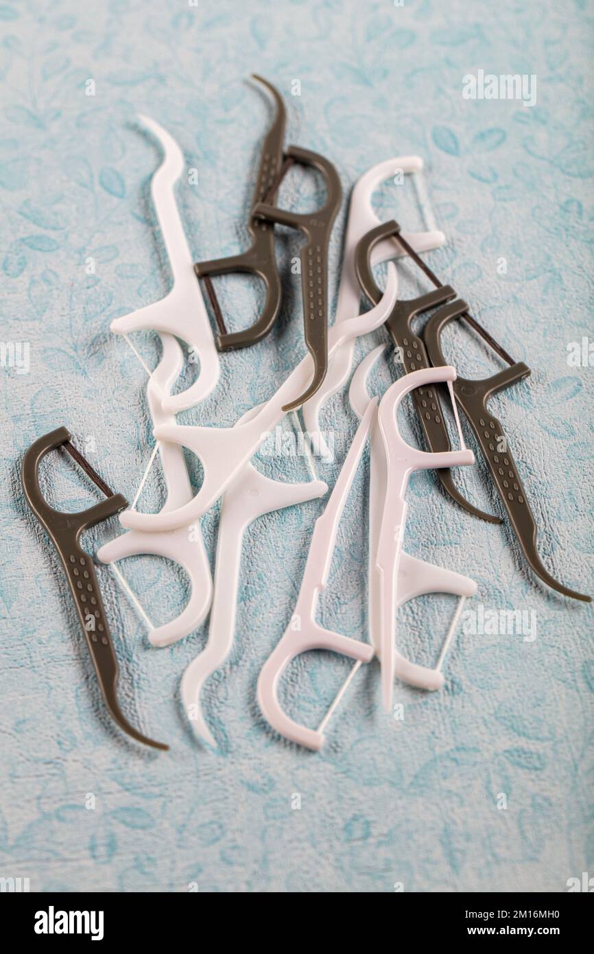 Colorful toothpick. Assorted colors dental floss pick on the color