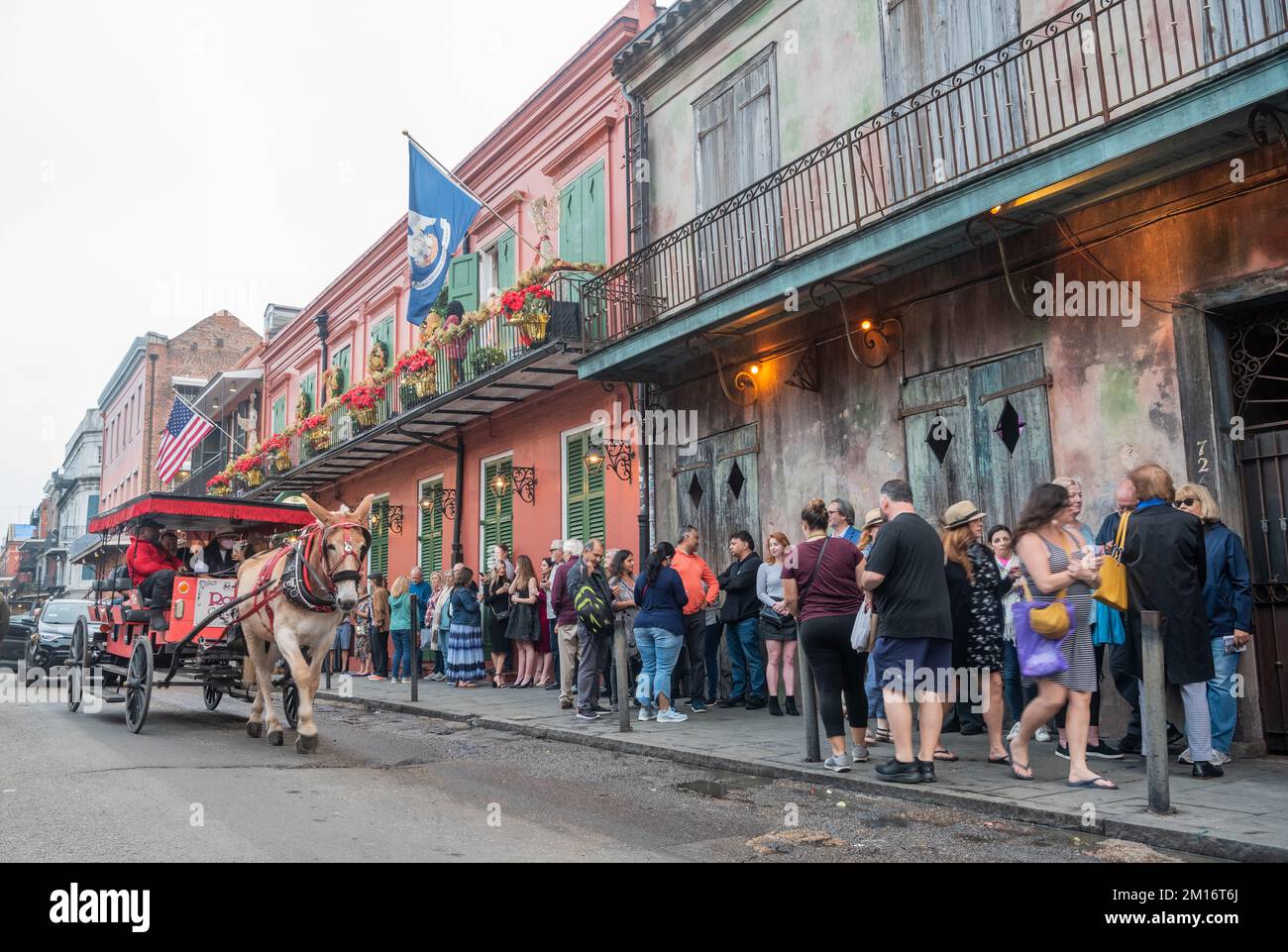 New Orleans, United States of America – December 4, 2022. View of St Peter street in New Orleans, with people queuing in front of the Preservation Hal Stock Photo