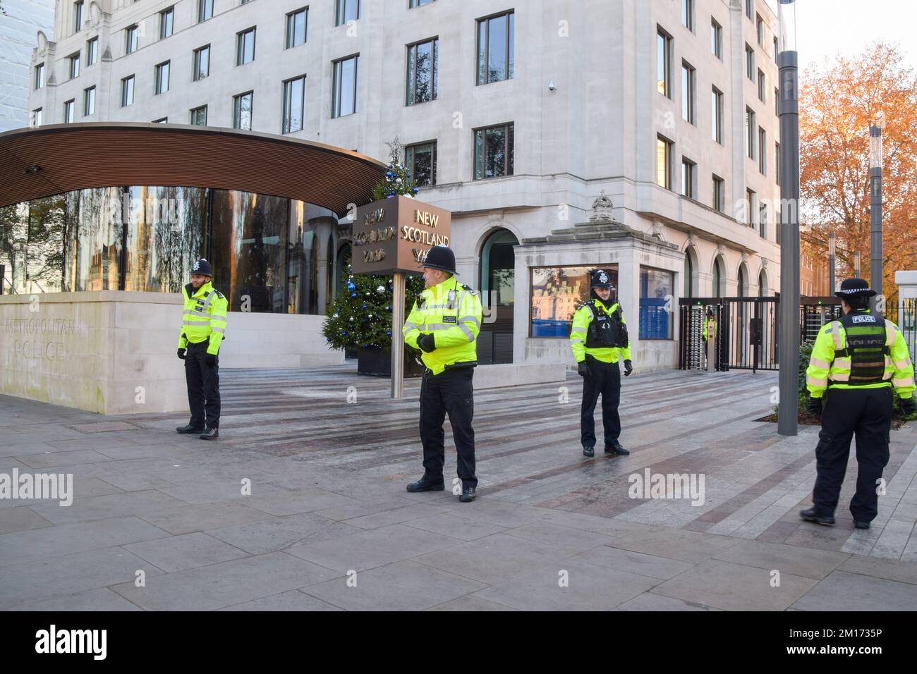 London, UK. 10th December 2022. Police officers stand guard outside New