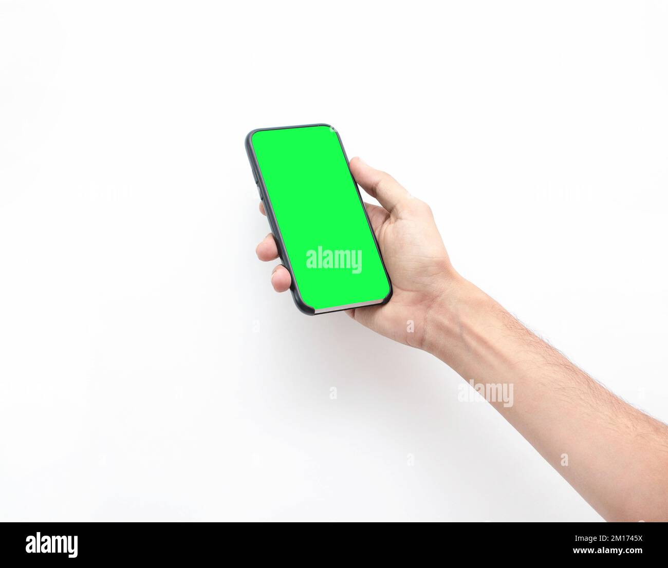 A hand holding a phone with a green screen isolated on white background ...