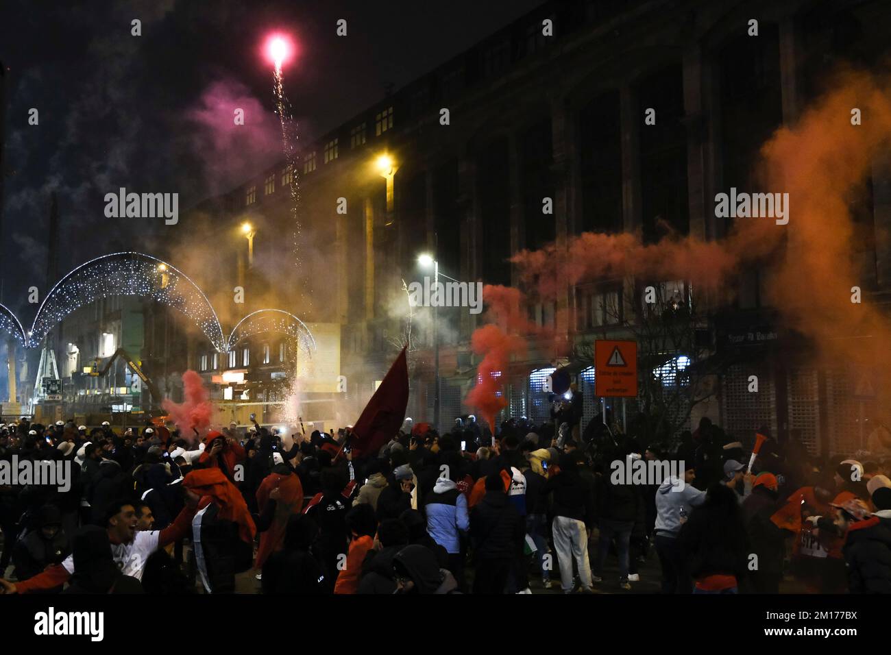 Brussels, Belgium. 10th Dec, 2022. Moroccan supporters celebrating their victory in the center of Brussels, after winning the quarter final game between Morocco and Portugal, at the FIFA 2022 World Cup. Belgium, December 10, 2022. Credit: ALEXANDROS MICHAILIDIS/Alamy Live News Stock Photo