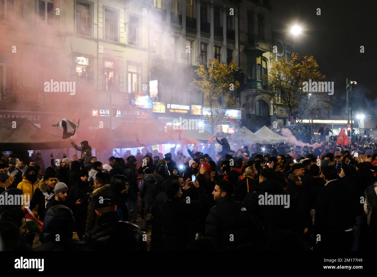 Brussels, Belgium. 10th Dec, 2022. Moroccan supporters celebrating their victory in the center of Brussels, after winning the quarter final game between Morocco and Portugal, at the FIFA 2022 World Cup. Belgium, December 10, 2022. Credit: ALEXANDROS MICHAILIDIS/Alamy Live News Stock Photo