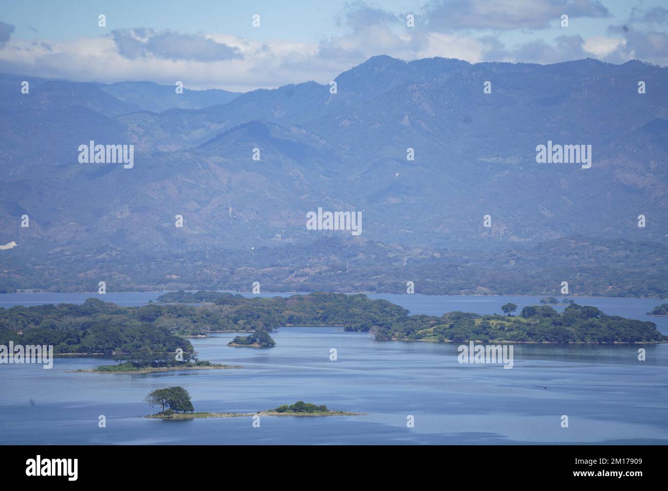 View of the Suchitlan lake in Suchitoto. The Suchitlan Lake is El Salvador's largest lake stretching over 134 kilometers across four regions of Chalatenango, Cabañas, Cuscatlan, and San Salvador. Stock Photo