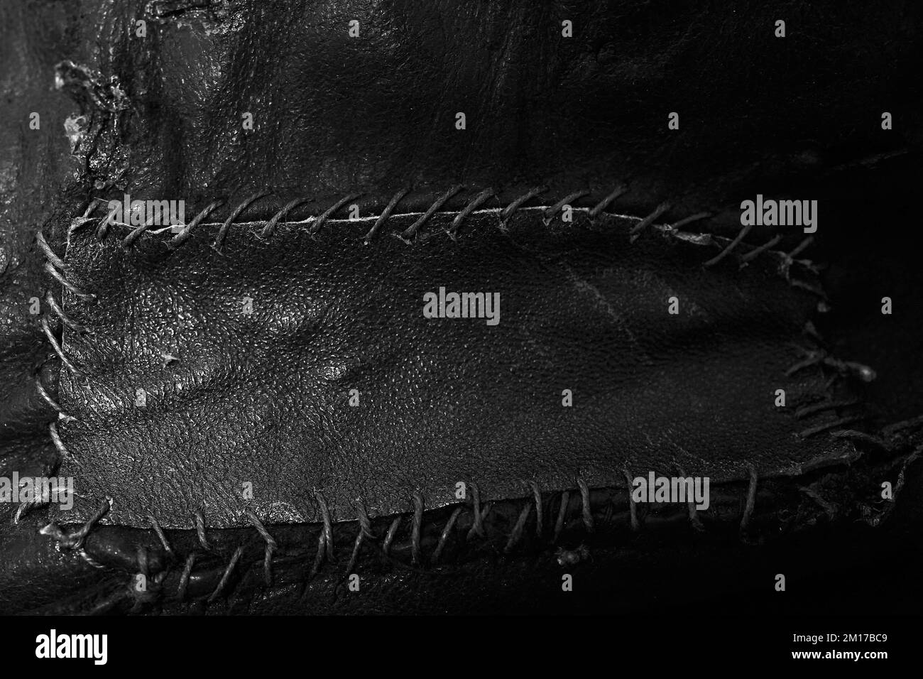 Close up of leather being stitched and patched Stock Photo