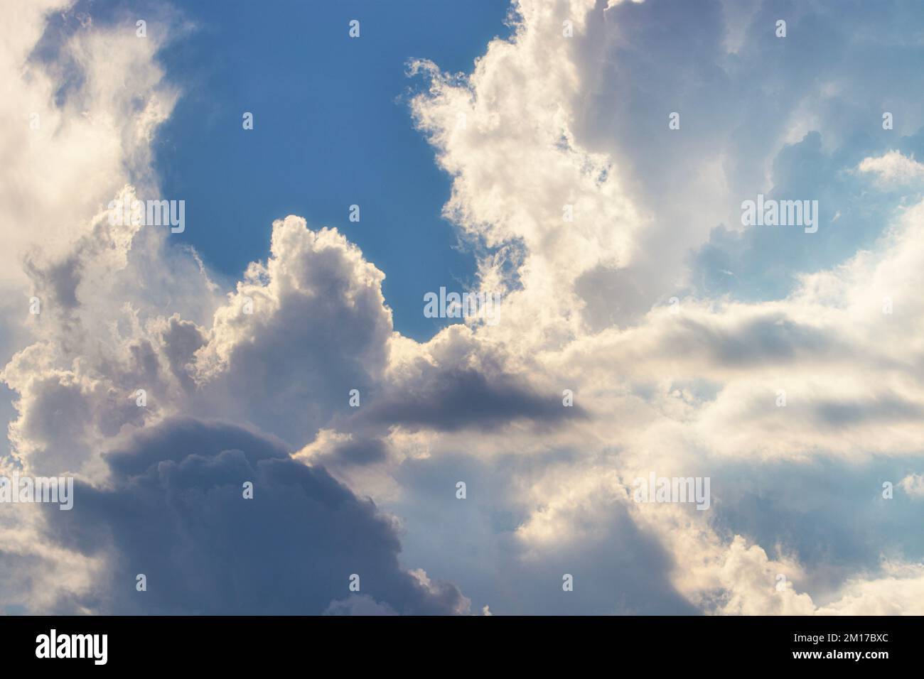 Bright Blue Sky With Fluffy White Clouds At Daytime Stock Photo - Alamy