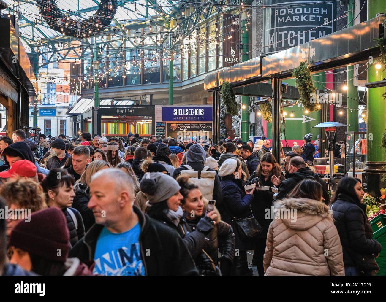 London, UK. 08th Dec, 2022. Festive shoppers, visitors and tourists crowd into the market halls at Borough Market to shop for artisan foods and stop for a mulled wine and other seasonal offerings. Credit: Imageplotter/Alamy Live News Stock Photo