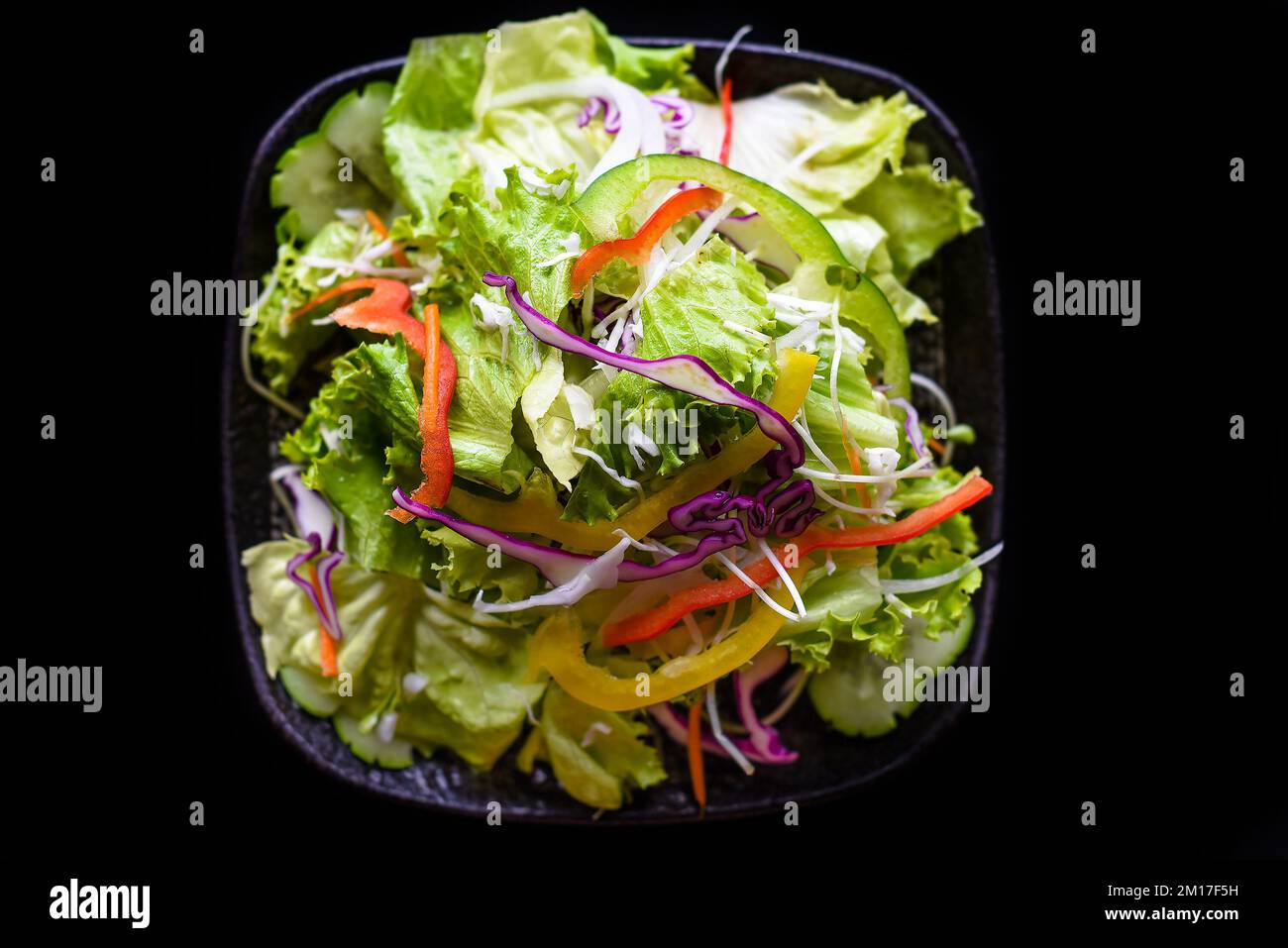 Fresh Vietnamese salad with vegetables on black background top view