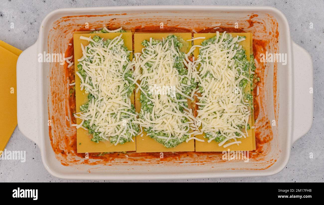 Spinach lasagna recipe. Lsagna noodles layer, spinach mix layer, marinara sauce layer, and layer