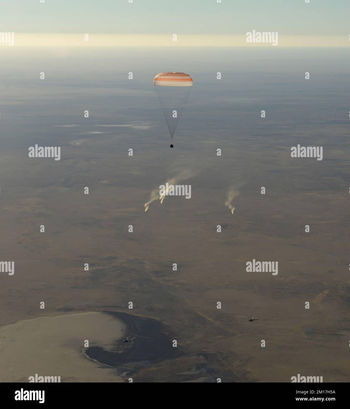 Parachute in the air with the Space Station Crew lands in Zhezkazgan, Kazakhstan. Digitally enhanced. Elements of this image furnished by NASA Stock Photo