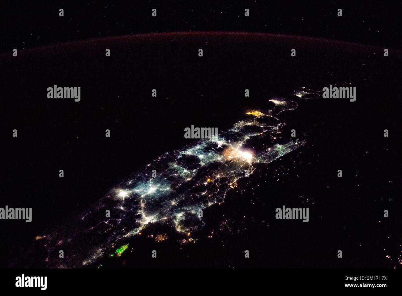 Night time sky aerial view of city lights in Java, Indonesia. Digitally