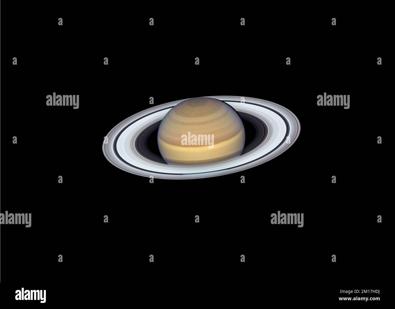 The planet Saturn viewed through a telescope with it's rings clearly seen. Digitally enhanced. Elements of this image furnished by NASA. Stock Photo