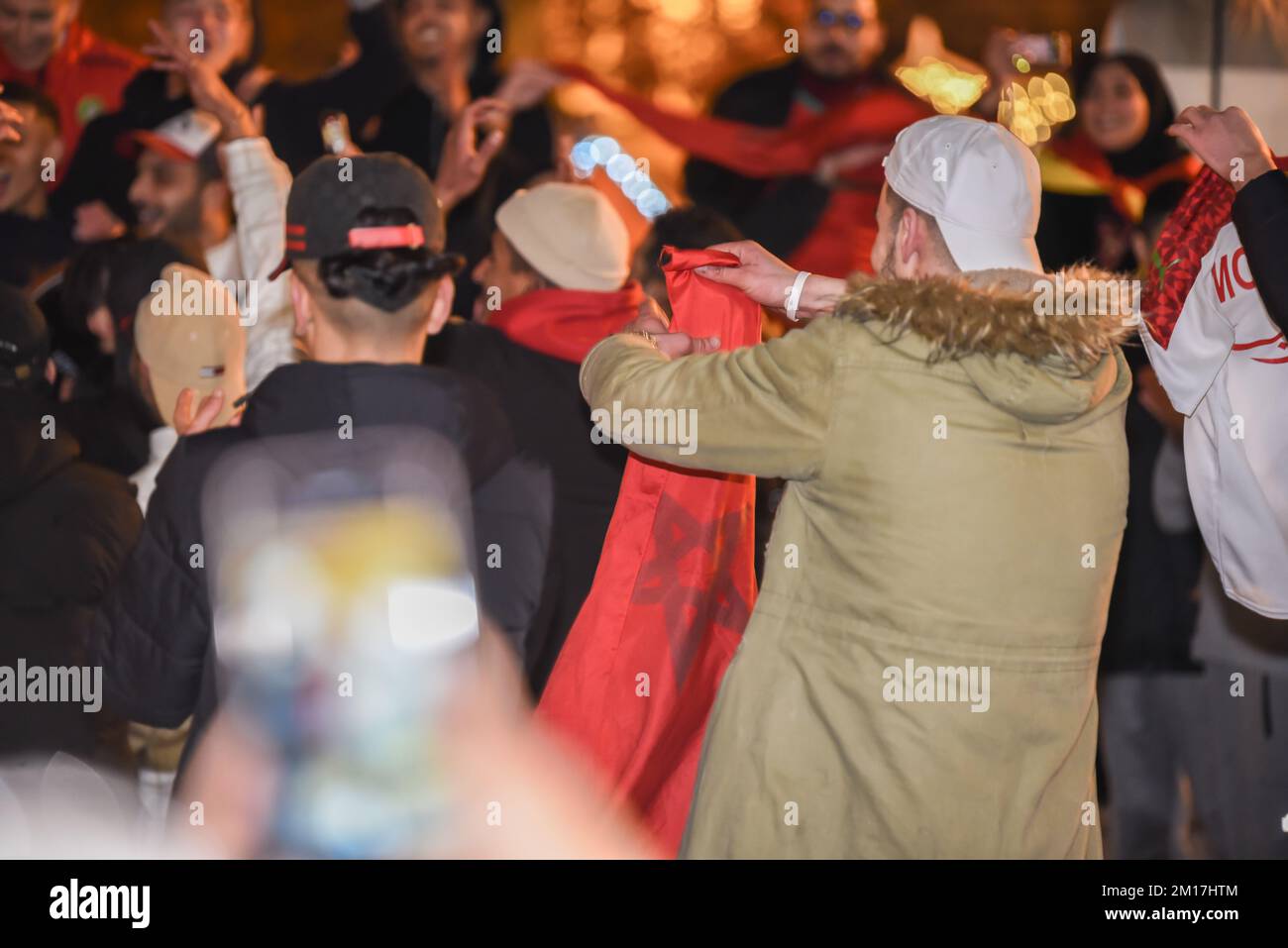 the moroccan people celebrate their victory in the world cup all over spain, in the picture a crowd of people celebrating in the main square of lugo t Stock Photo