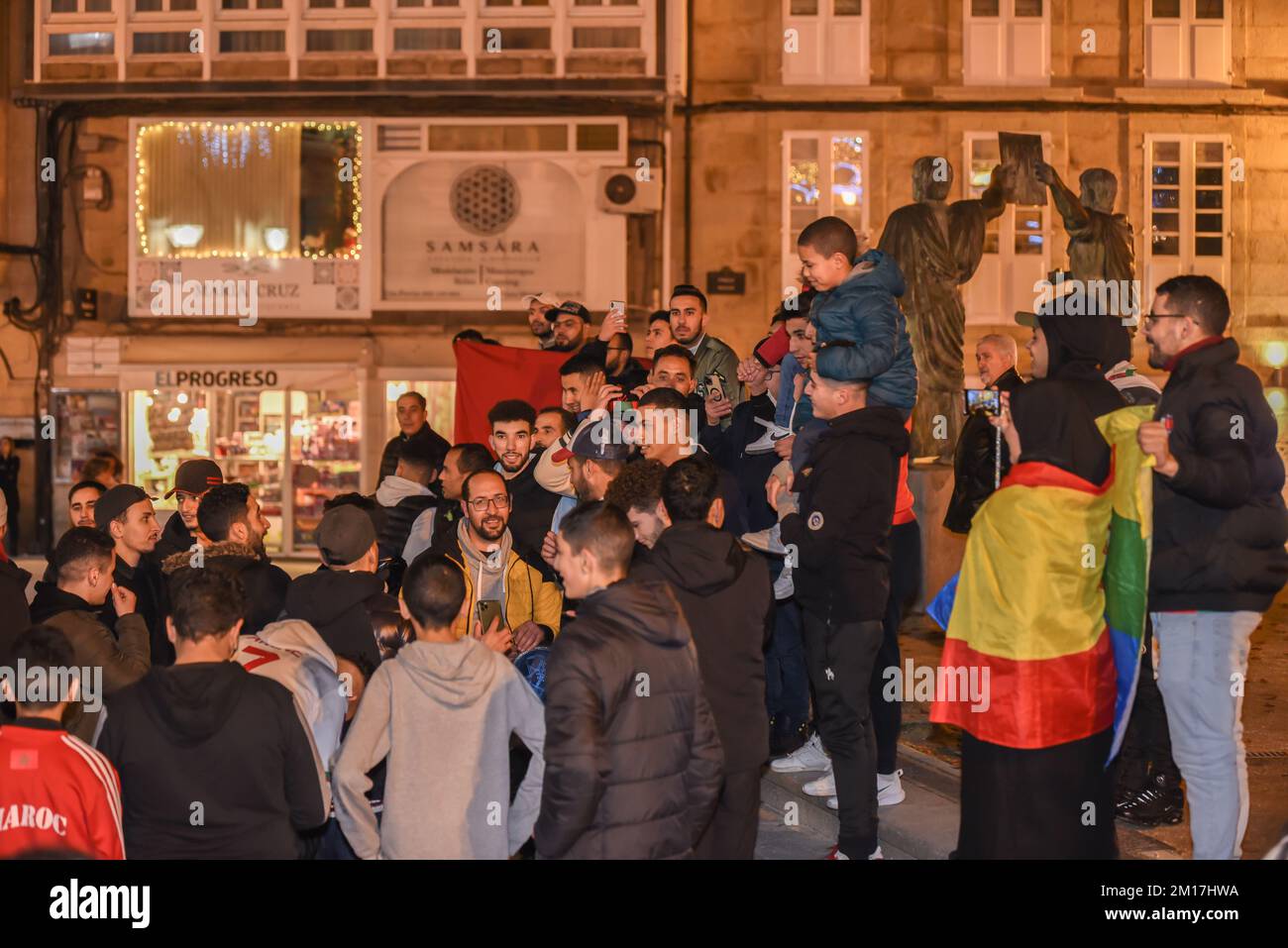 the moroccan people celebrate their victory in the world cup all over spain, in the picture a crowd of people celebrating in the main square of lugo t Stock Photo