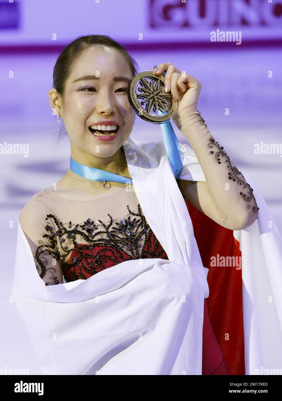 Japan's Mai Mihara poses after winning gold at the Grand Prix Final