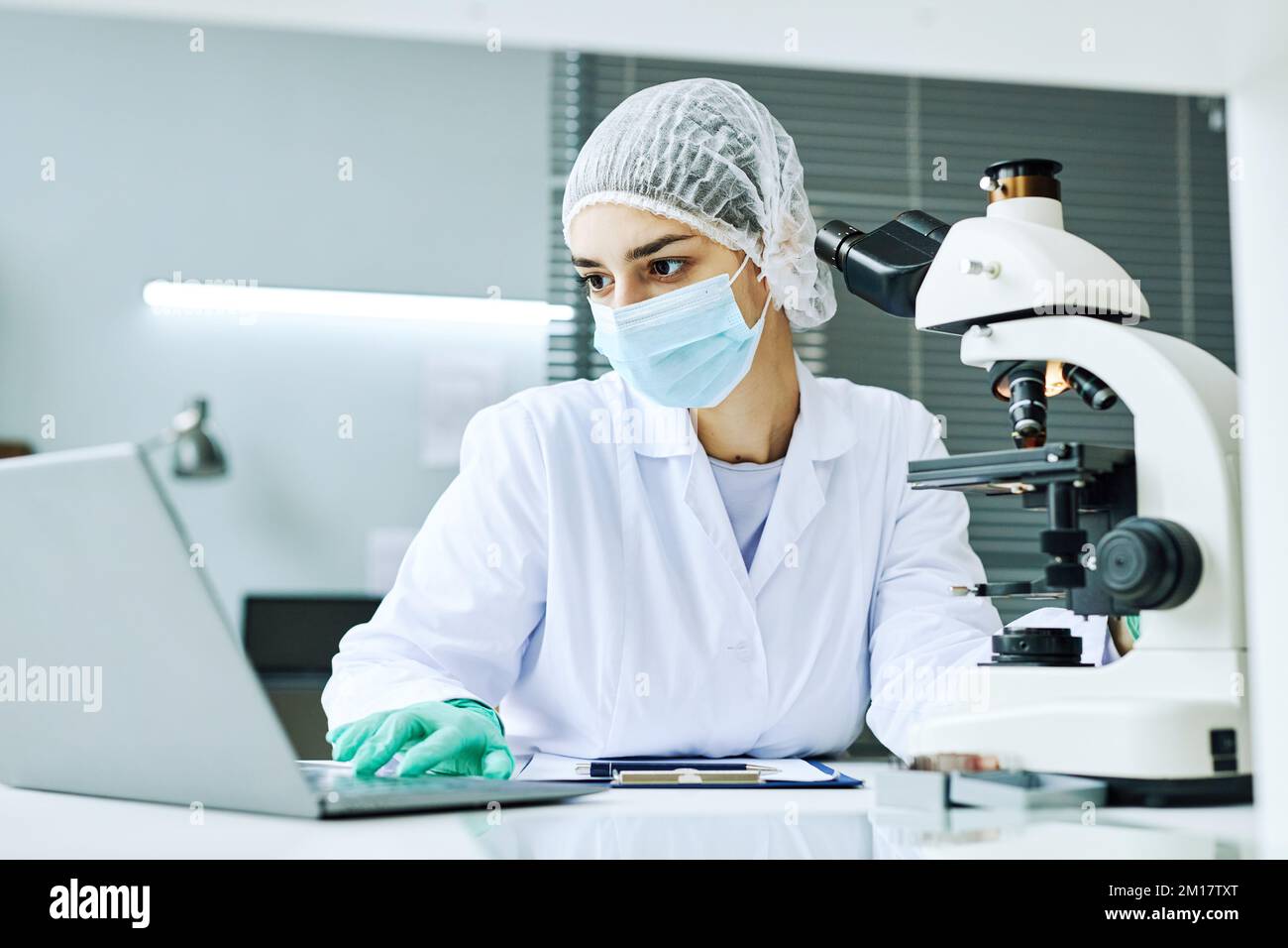 Portrait of Middle Eastern young woman as female scientist working in medical laboratory Stock Photo