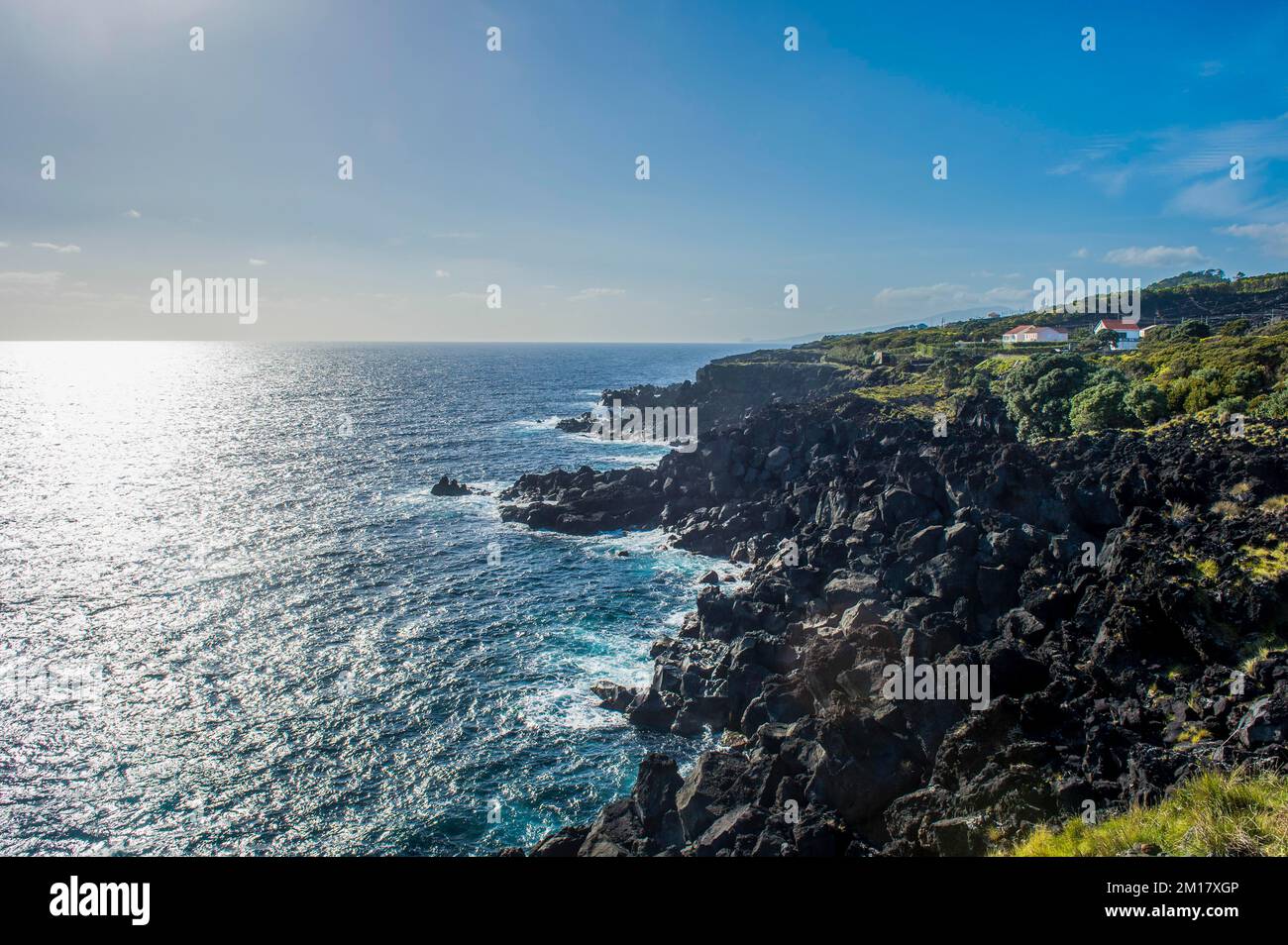 Rocky volcanic coastline around Sao Mateus, Island of Pico, Azores, Portugal, Europe Stock Photo