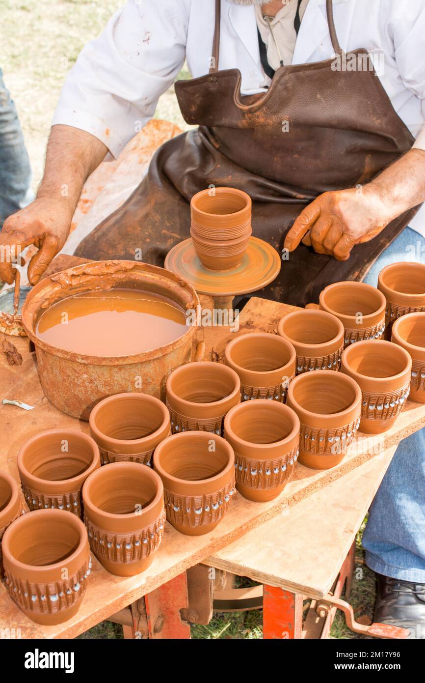 Potter's hands shaping up the clay of the pot Stock Photo Alamy