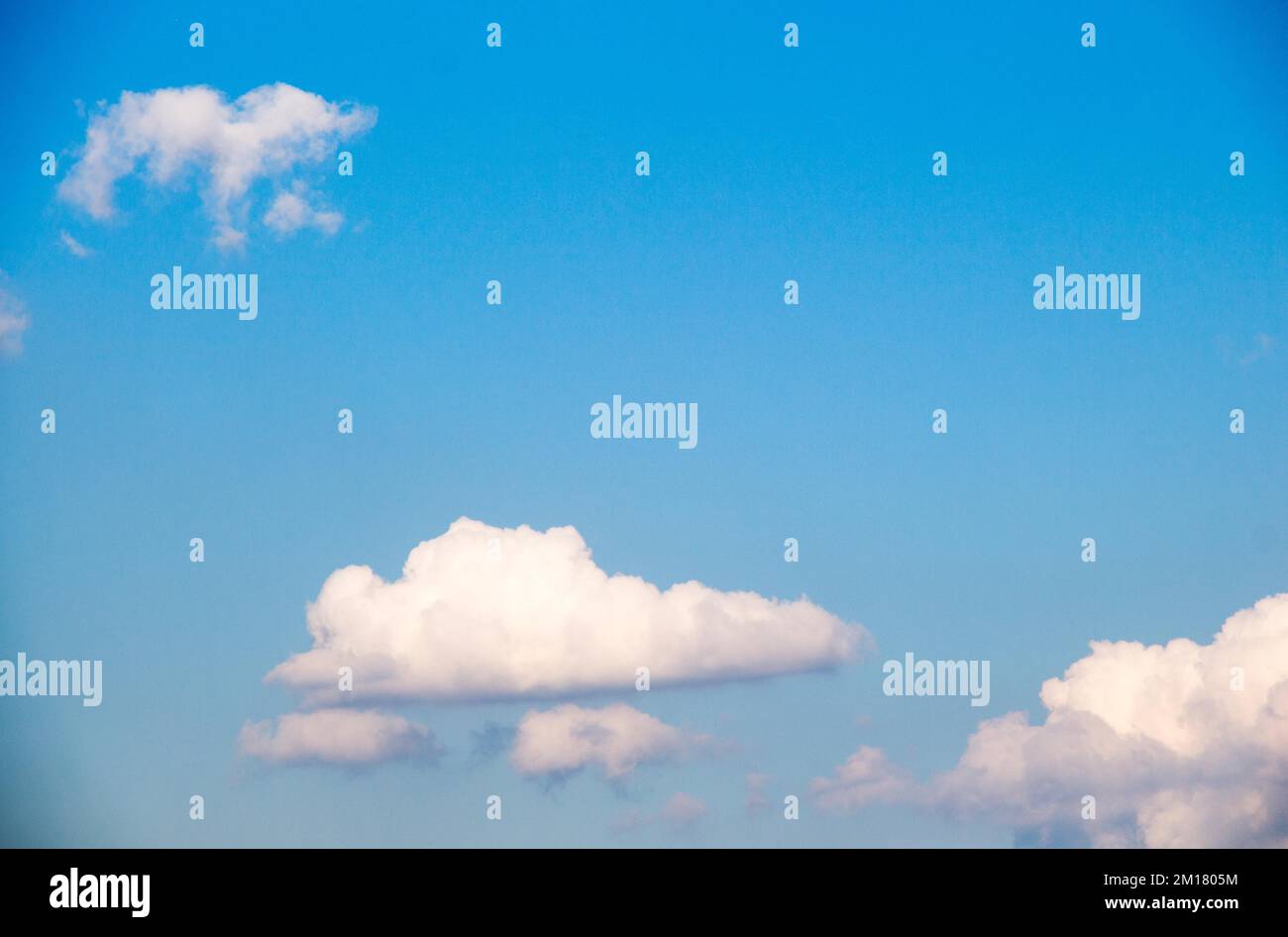 Blue Sky filled with white clouds Stock Photo - Alamy