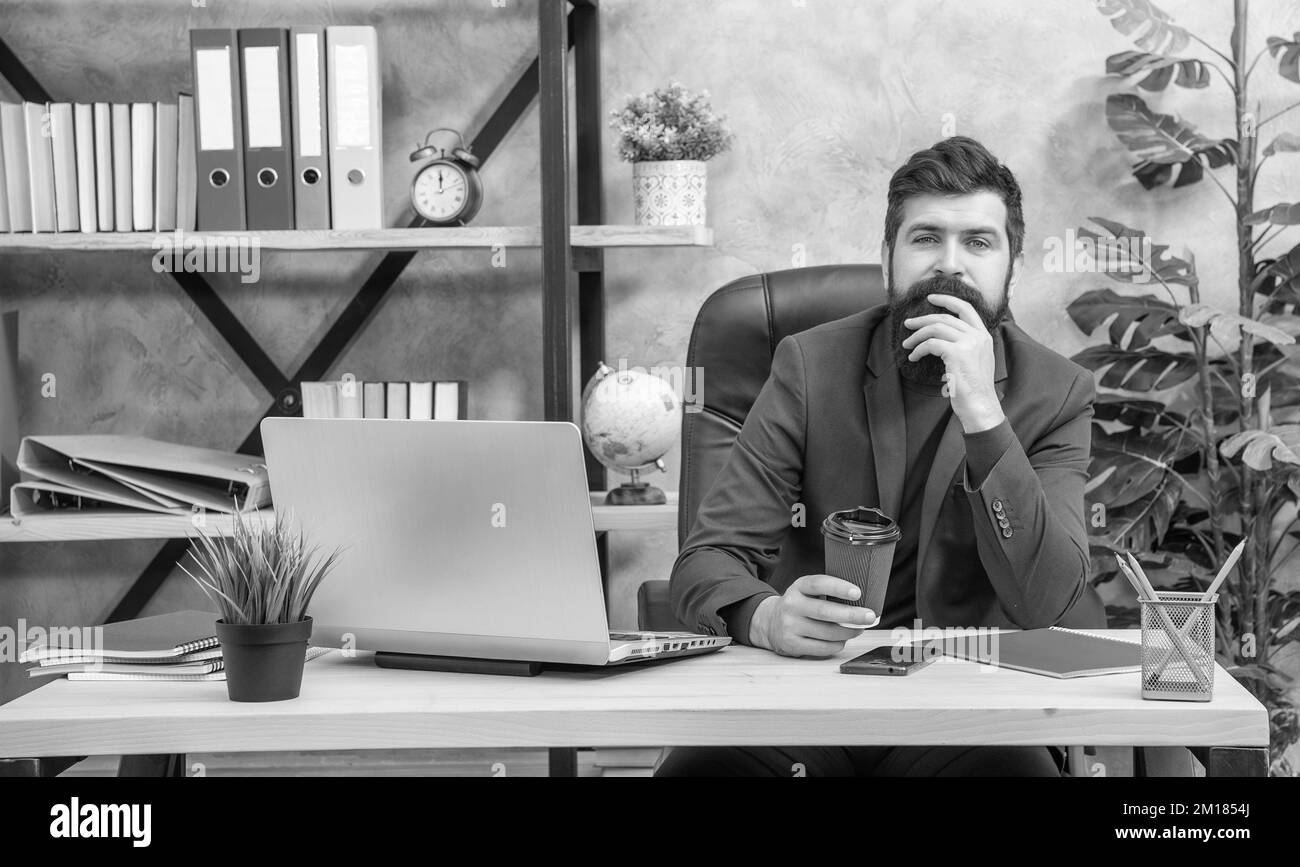 brutal positive network administrator with pc at office, businesslike ...