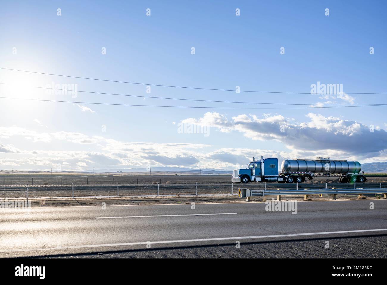 Blue Big Rigg Classic blue big rig semi truck with chrome accessories transporting ...