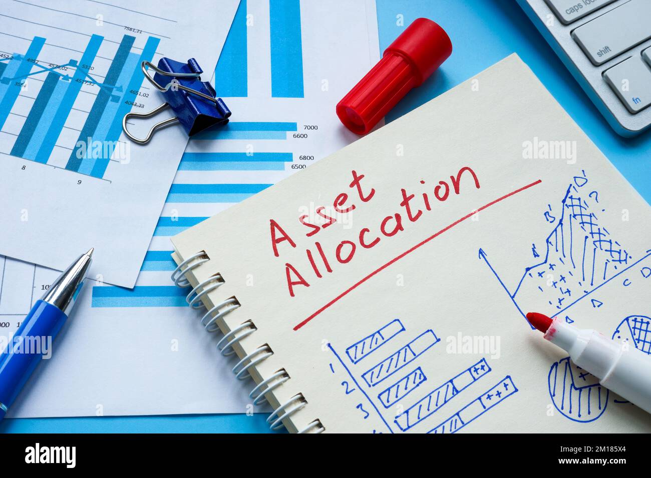 Notebook with sign asset allocation and calculations. Stock Photo