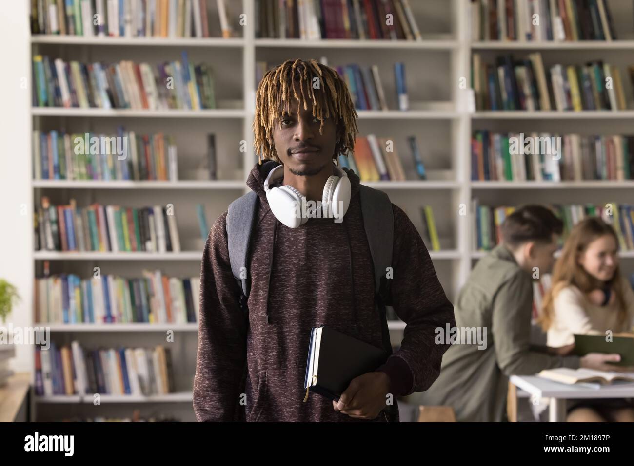 Serious young African American student guy with blonde dreads Stock Photo