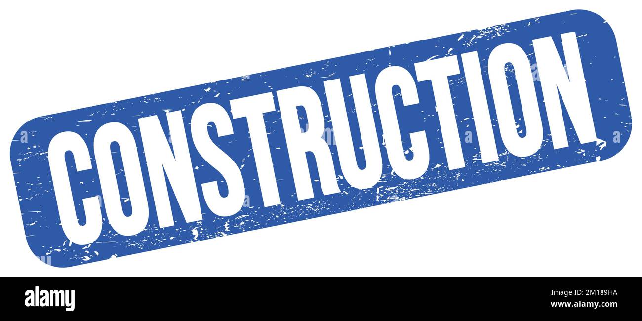 CONSTRUCTION text written on blue grungy stamp sign Stock Photo - Alamy