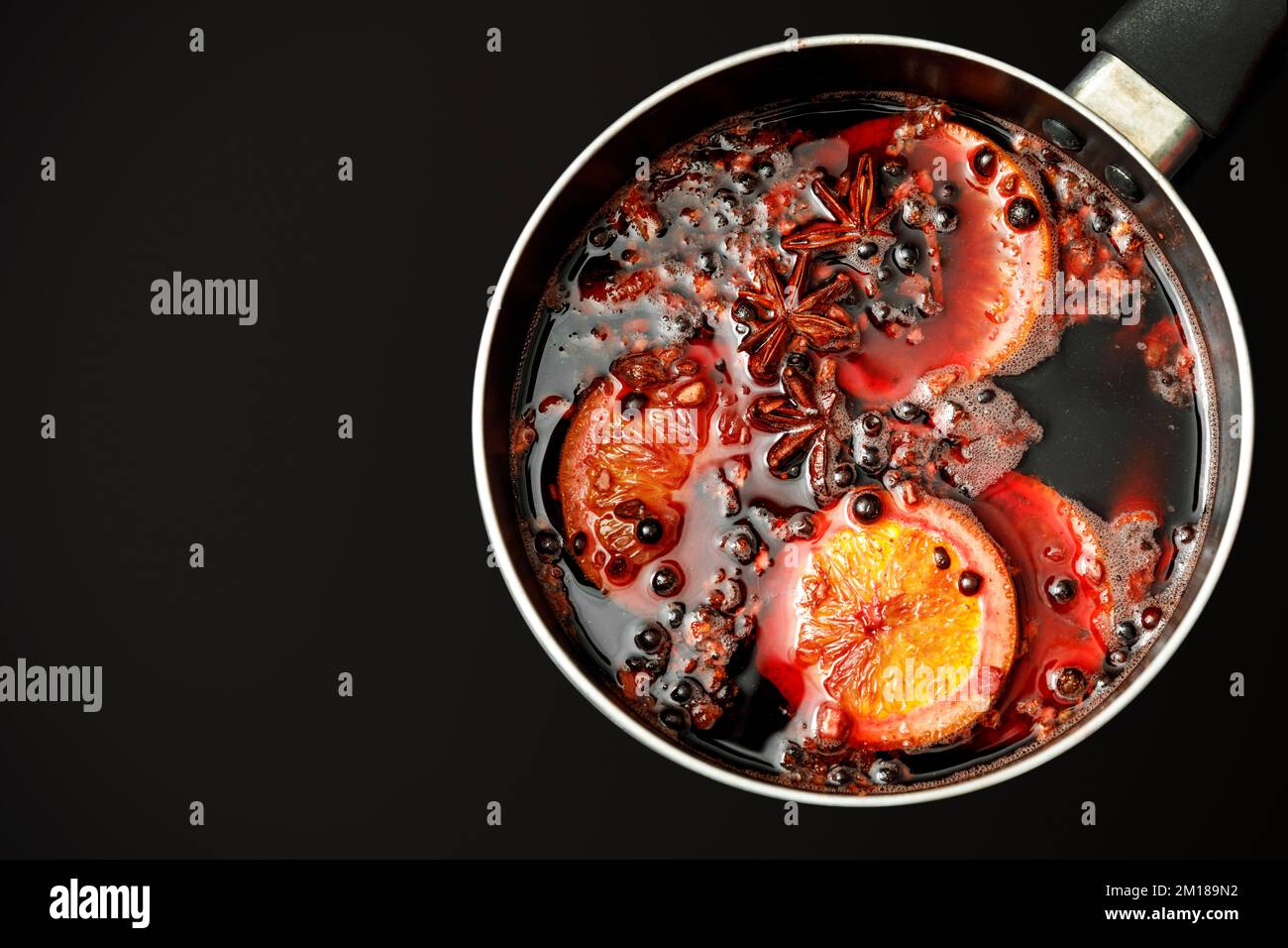 Hot mulled wine boiled in a pot, top view Stock Photo