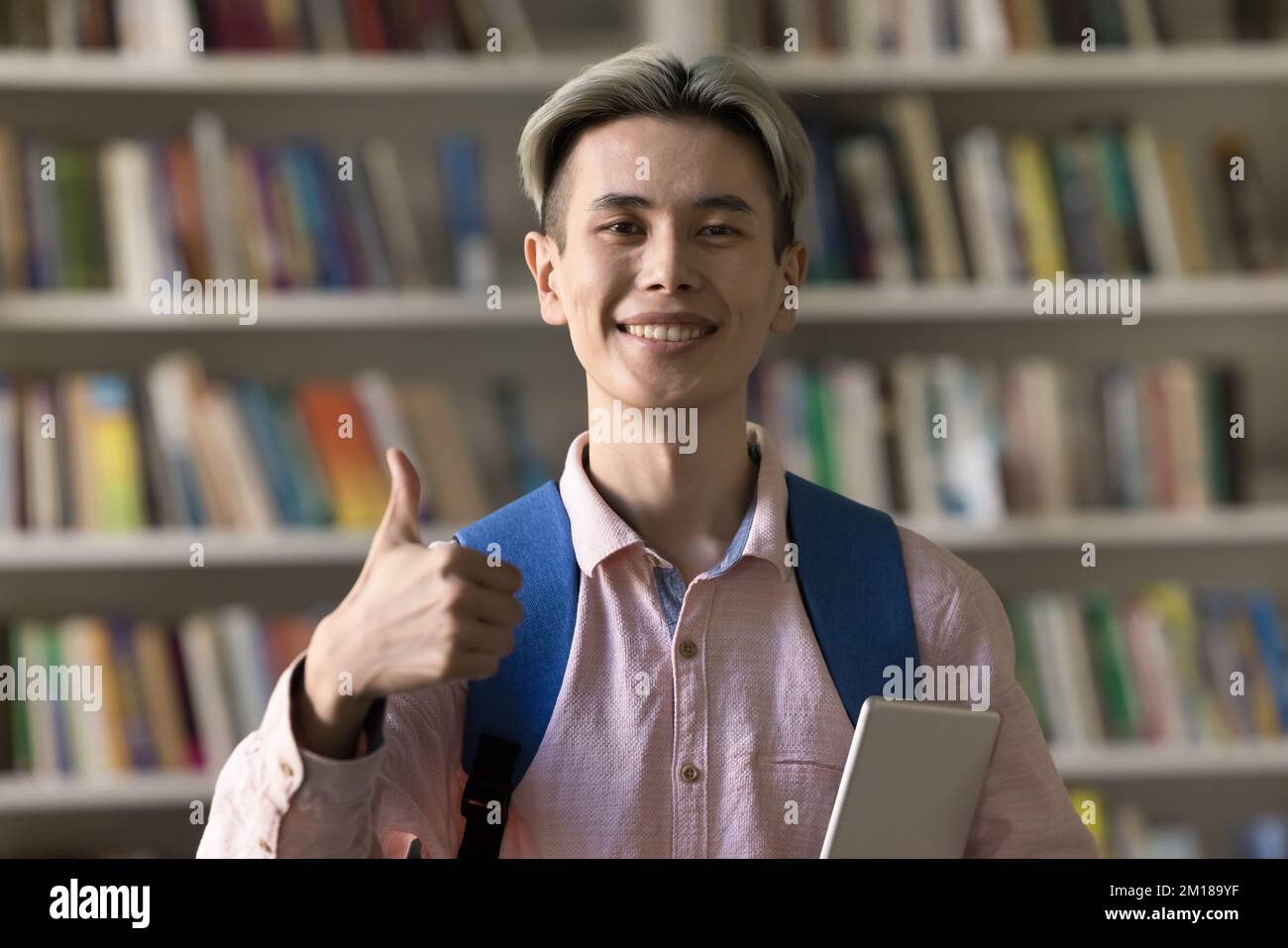 Happy teen student guy giving positive feed back to college Stock Photo